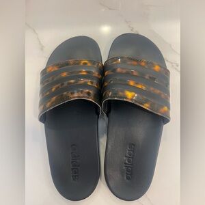 Adidas Adilette Comfort slides tortoise and black.
